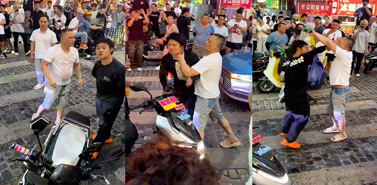 奇葩解压名场面 两男子街头吵架互吐口水 最后竟演变成泼水大作战